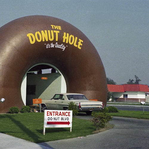 FILE - A drive-thru coffee and donut shop the Donut Hole is seen in Los Angeles in November 1970. (AP Photo/David F. Smith, File)