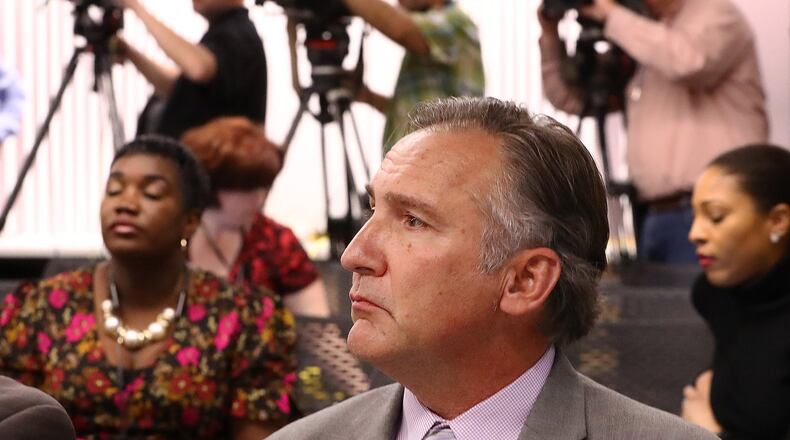 News cameras look on as Superintendant Dr. Mike Looney arrives Monday for a press conference announcing school closures after a Bear Creek Middle School teacher had a confirmed case of COVID-19. Curtis Compton ccompton@ajc.com