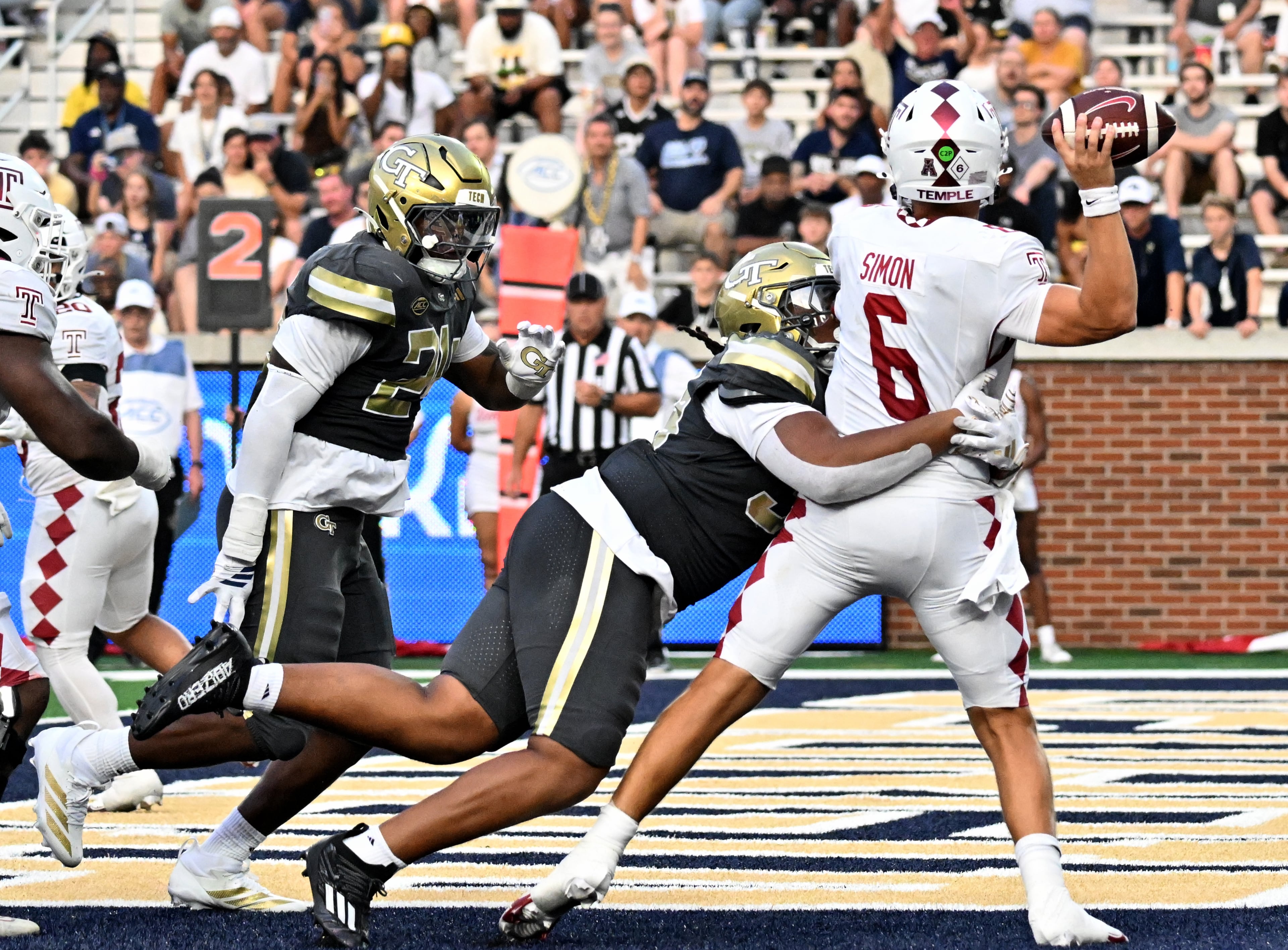 Georgia Tech defensive lineman Ronald Triplette (24) sacks Temple quarterback Evan Simon (6) during the second half of an NCAA college football game at Georgia Tech's Bobby Dodd Stadium, Saturday, November 20, 2025 in Atlanta. Georgia Tech won 45-24 over Temple. (Hyosub Shin / AJC)