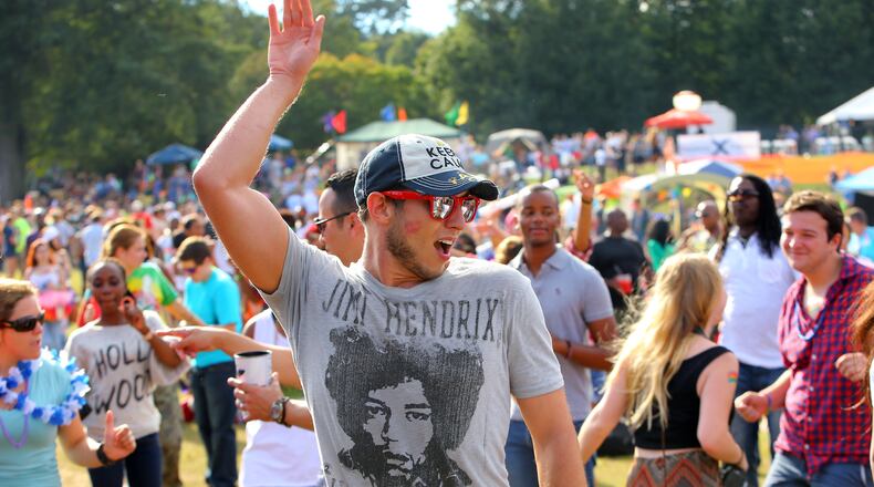 Thousands of people celebrate at the 43rd Annual Pride Festival at Piedmont Park last October. CURTIS COMPTON / CCOMPTON@AJC.COM