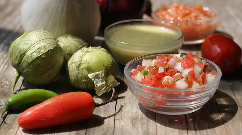 Homemade salsas are easy to make and use fresh in-season ingredients. Pictured from front to back: pico de gallo, salsa verde, and Olivia’s salsa. (Hillary Levin/St. Louis Post-Dispatch/TNS)
