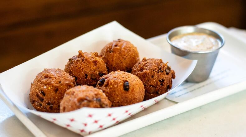 Vidalia Onion Hush Puppies at Lure. CONTRIBUTED BY HENRI HOLLIS