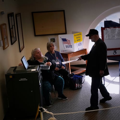 Terry O'Neill casts his ballot while voting at City Hall, Tuesday, Nov. 4, 2025, in Ellsworth, Maine. (AP Photo/Robert F. Bukaty)