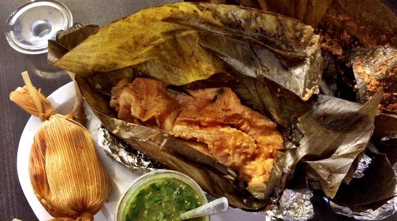 A chuchito and a pache tamale are served with bright green salsa at Xelapan Cafeteria. CREDIT: CONTRIBUTED