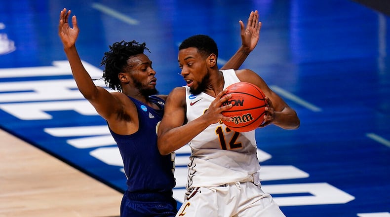 Loyola Chicago guard Marquise Kennedy, right, backs down Georgia Tech guard Bubba Parham in the first half of a college basketball game in the first round of the NCAA tournament at Hinkle Fieldhouse, Indianapolis, Friday, March 19, 2021. (AP Photo/AJ Mast)