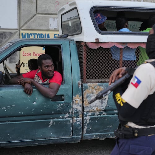 A police officer stands guard in Port-au-Prince, Haiti, Tuesday, March 3, 2026. (AP Photo/Odelyn Joseph)