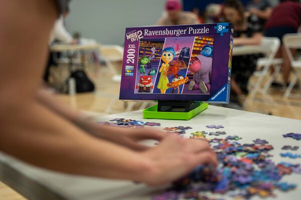 Speed puzzlers put their brains, eyes and fingers to work at the Georgia Speed Puzzling Championship. (Olivia Bowdoin for the AJC)