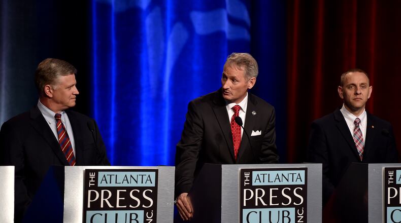Drew Ferguson, left, and Mike Crane, center, will face off in July's runoff for the Republican nomination in Georgia's 3rd Congressional District. BRANT SANDERLIN/BSANDERLIN@AJC.COM