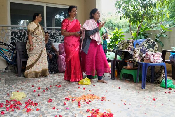 A wailing relative reacts as the body of 14-year-old Divyanshi Shivakumar, who lost her life in Wednesday's deadly stampede during celebrations outside a stadium for Royal Challengers Bengaluru, winners of the Indian Premier League, is taken away for her last rites in Bengaluru, India, Thursday, June 5, 2025. (AP Photo/Aijaz Rahi)