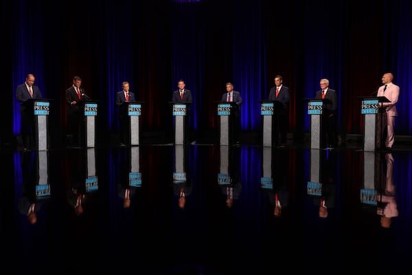 Republican candidates for governor (from left) Chris Carr, Clark Dean, Rick Jackson, Burt Jones, Gregg Kirkpatrick, Brad Raffensperger, Tom Williams and Ken Yasger appear at the Atlanta Press Club Loudermilk-Young governor debate last week. (Arvin Temkar/AJC)
