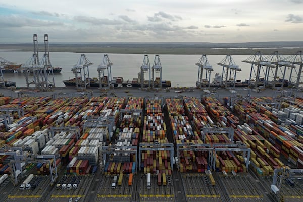 FILE - Shipping containers wait to be processed at London Gateway port, in Stanford-le-Hope, on the Thames estuary east of London, England, Wednesday, Feb. 5, 2025. (AP Photo, File)