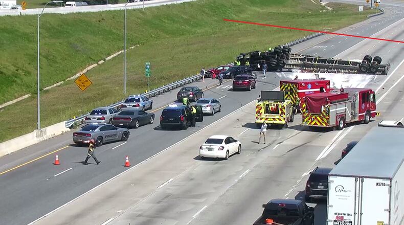 An overturned tractor-trailer earlier had all lanes of traffic blocked on I-75.