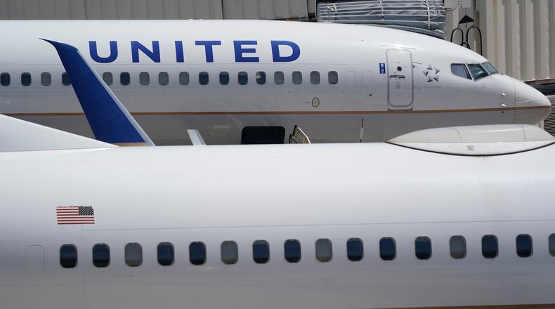 FILE - Two United Airlines Boeing 737s are shown parked at the gate, July 7, 2022, at the Fort Lauderdale-Hollywood International Airport in Fort Lauderdale, Fla. (AP Photo/Wilfredo Lee, File)WLD