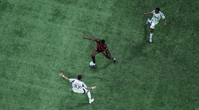 Atlanta United forward Emmanuel Latte Lath #19 dribbles during the match against the New England Revolution at Mercedes-Benz Stadium in Atlanta, GA on Saturday April 12, 2025. (Photo by Jay Bendlin/Atlanta United)