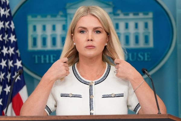 White House press secretary Karoline Leavitt adjusts her hair as she speaks with reporters in the James Brady Press Briefing Room at the White House, Thursday, July 17, 2025, in Washington. (AP Photo/Alex Brandon)