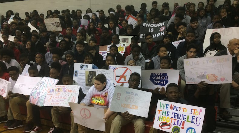 Students at Mundy's Mill Middle School in Clayton County gathered to remember the recent mass school shooting in Florida and also express their views, some of which were anti-gun, during the school walkout March 14.