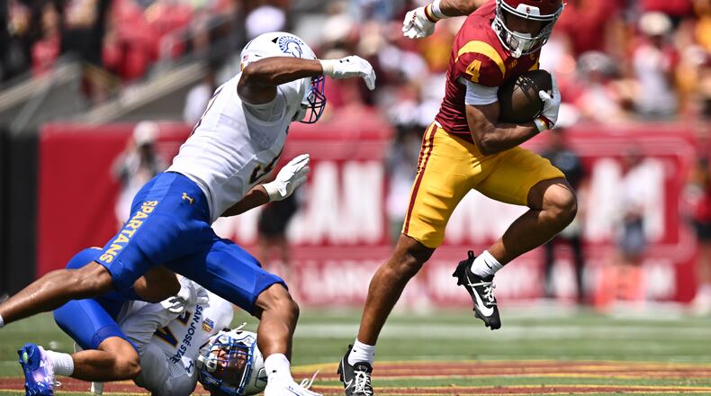 Southern California wide receiver Trent Mosley (4) runs with the ball during the first half of an NCAA college football game against San Jose State, Saturday, Aug. 29, 2026, in Los Angeles. (AP Photo/William Liang)