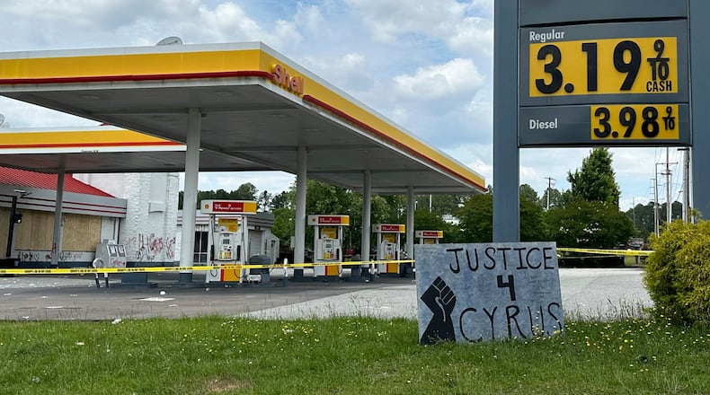 FILE - A sign calling for justice is for Cyrus Carmack-Belton is seen outside a gas station June 1, 2023, in Columbia, S.C. (AP Photo/Jeffrey Collins, File)