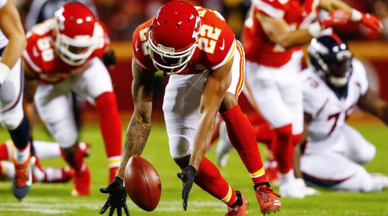 Kansas City Chiefs cornerback Marcus Peters (22) helped pick up the spirits of 300 youths when he passed out winter coats on Saturday.