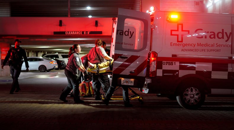 Grady Memorial Hospital paramedics load a gunshot victim into an ambulance Thursday outside the Camden Vantage Apartments on Jackson Street. The man was shot multiple times, according to Atlanta police.