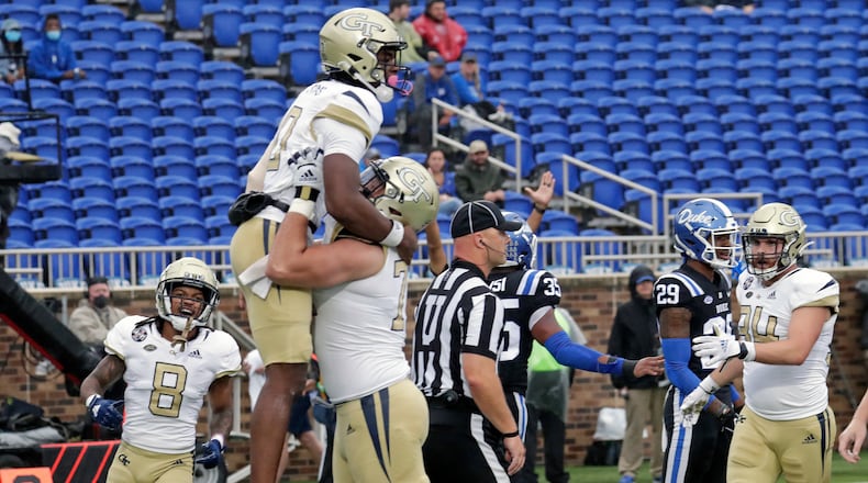 Georgia Tech quarterback Jeff Sims (10) celebrates his touchdown with teammates after he scored against Duke during the first half of an NCAA college football game in Durham, N.C., Saturday, Oct. 9, 2021. (AP Photo/Chris Seward)