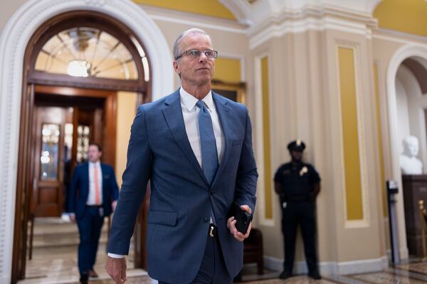 Senate Majority Leader John Thune, R-S.D., strides from the chamber as Republicans begin a final push to advance President Donald Trump's tax and spending bill.