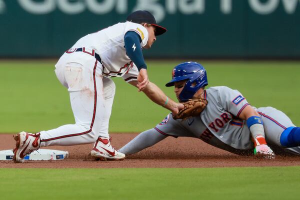 Mets third baseman Bo Bichette (right) steals second base ahead of the tag by Braves shortstop Jim Jarvis at Truist Park on Monday, Aug. 10, 2026, in Atlanta. (Jason Getz/AJC)