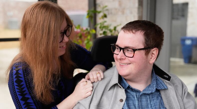Kaci LaFon, left, appears with her husband Collin LaFon at their home in Trussville, Ala., on on Friday, Nov. 21, 2025. (AP Photo/Brynn Anderson)