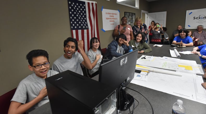 Members of “SPARK” team, eighth-graders from Coleman Middle School, react as they find out the site plan they designed and presented at Columbia Engineering Services in Duluth on Tuesday, Feb. 20, 2018, was the winner. Twenty-eight students from Coleman spent the day at Columbia Engineering getting hands-on experience while exploring the roles of civil engineers. HYOSUB SHIN / HSHIN@AJC.COM