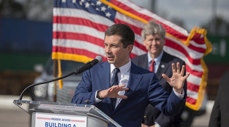 U.S. Transportation Secretary Pete Buttigieg speaks to the media during his visit to the Georgia Ports Authority's Megarail facility on Friday. Buttigieg's visit highlighted recent coordination with the U.S. Department of Transportation and the Georgia Ports Authority to improved its cargo flow by increasing rail capacity and activating flexible "pop-up" container yards near manufacturing and distribution centers. (AJC Photo/Stephen B. Morton)