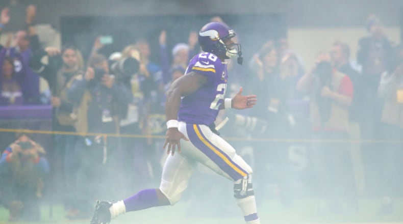 Adrian Peterson #28 of the Minnesota Vikings runs on field during pregame introductions before playing the Indianapolis Colts on December 18, 2016 at US Bank Stadium in Minneapolis, Minnesota.