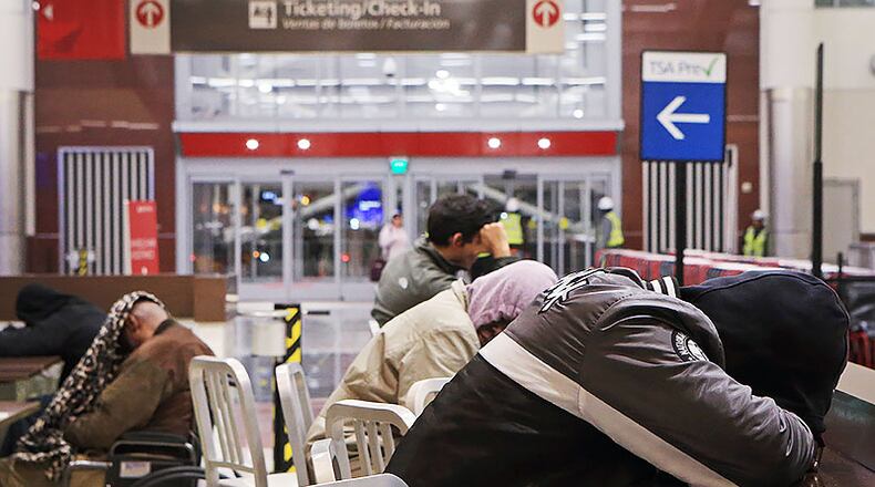 Caption: Several people sleep in the domestic terminal of Hartsfield-Jackson International Airport on Friday, February 7, 2020, in Atlanta. Many of Atlanta’s homeless sleep overnight in the airport’s domestic terminal when the city experiences frigid temperatures. (Christina Matacotta/crmatacotta@gmail.com)