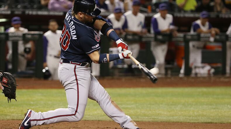 Atlanta Braves' Josh Donaldson connects for a home run against the Arizona Diamondbacks during the ninth inning of a baseball game Thursday, May 9, 2019, in Phoenix. (AP Photo/Ross D. Franklin)