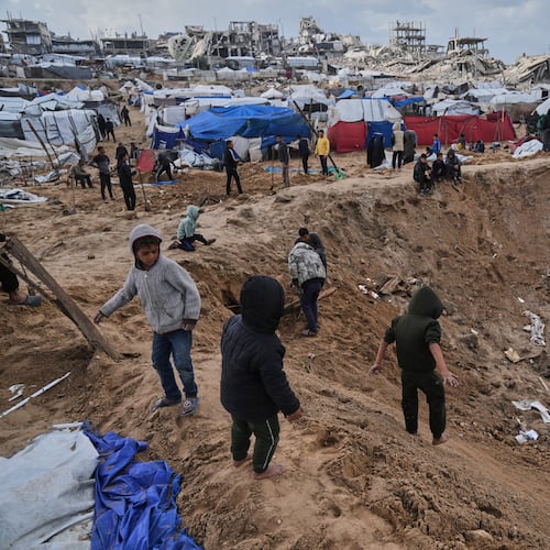 Palestinians inspect the damage at a displacement camp following an Israeli strike in Gaza City, Friday, Jan. 9, 2026. (AP Photo/Jehad Alshrafi)