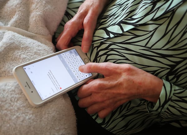Mary Rose Taylor, once an articulate voice in the effort to battle neuro-degenerative diseases, eventually communicated by using her iPhone. Curtis Compton/ccompton@ajc.com