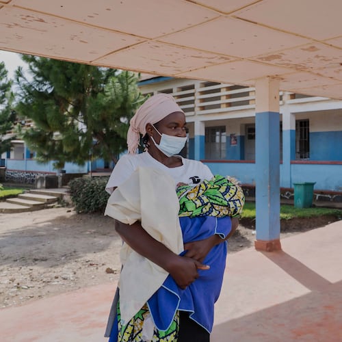 A woman wearing a protective mask stands in the corridor of a hospital in Bunia, Congo, Sunday, May 17, 2026. (AP Photo/ Dirole Lotsima Dieudonne)
