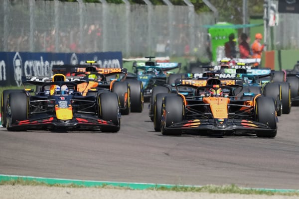 Red Bull driver Max Verstappen of the Netherlands, left, and McLaren driver Oscar Piastri of Australia leadat the start during the Italy's Emilia Romagna Formula One Grand Prix, in Imola, Italy, Sunday, May 18, 2025. (AP Photo/Antonio Calanni)