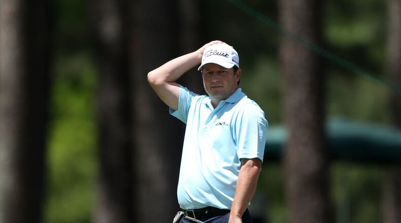 Tim Clark reacts to missing a putt on #15 green during the third round in the Masters Tournament on Saturday April 13 2013.
