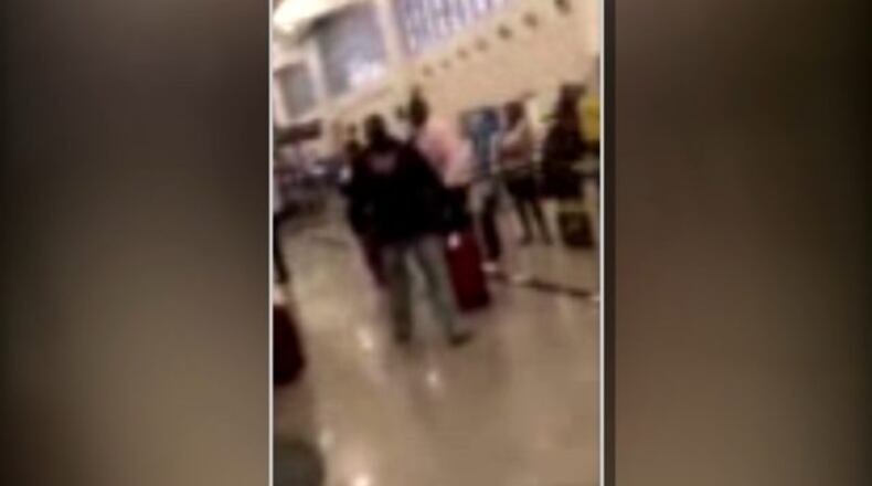 Cellphone video taken Tuesday at Hartsfield-Jackson Airport appears to show Charles Haywood become aggressive with travelers after being denied access to a flight.