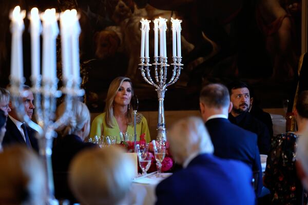 Netherland's Queen Maxima, center left, and Ukraine's President Volodymyr Zelenskyy, right, attend a dinner of NATO heads of state and government at the Paleis Huis ten Bosch ahead of the NATO summit in The Hague, Netherlands, Tuesday, June 24, 2025. (Remko de Waal, Pool Photo via AP)