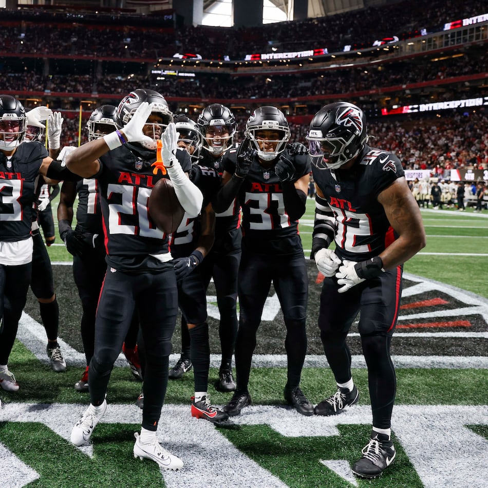 Atlanta Falcons cornerback Dee Alford (20), center, reacts after an interception in the second half of an NFL football game against the New Orleans Saints at Mercedes-Benz Stadium in Atlanta on Sunday, January 4, 2026.
(Miguel Martinez/AJC)