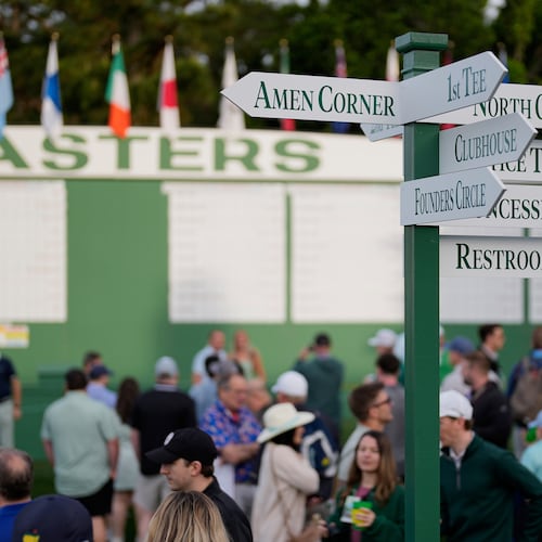 Patrons arrive for a practice at the Masters golf tournament at the Augusta National Golf Club, Monday, April 6, 2026, in Augusta, Ga. (AP Photo/David J. Phillip)