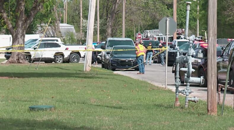 In this image taken from video provided by Oklahoma television station KFOR, authorities block off an area following a shooting inside a high school, Tuesday, April 7, 2026, in Pauls Valley, Okla. (KFOR via AP)