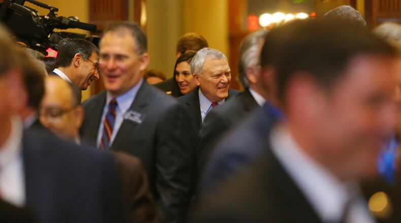 011415 ATLANTA: Governor Nathan Deal follows his escort into the House chambers to deliver the State of the State address to a joint session during legislative day 3 on Wednesday, Jan. 14, 2015, in Atlanta. Curtis Compton / ccompton@ajc.com Gov. Nathan Deal follows his escort into the House chambers to deliver the State of the State address to a joint session on Wednesday. Curtis Compton, ccompton@ajc.com