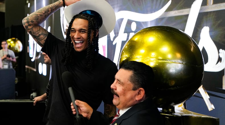 New York Knicks guard Jordan Clarkson laughs with comedian Guillermo Rodriguez before a workout prior to the start of the NBA Finals basketball series against the San Antonio Spurs, Tuesday, June 2, 2026, in San Antonio. (AP Photo/David J. Phillip)