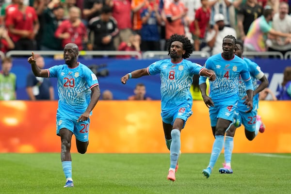 DR Congo's Yoane Wissa (left) celebrates after scoring his team's first goal during its World Cup match against Portugal on Wednesday, June 17, 2026. (Karen Warren/AP)