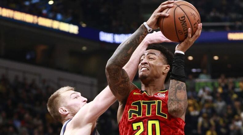 John Collins made his season debut Saturday with 12 points in 12 minutes.