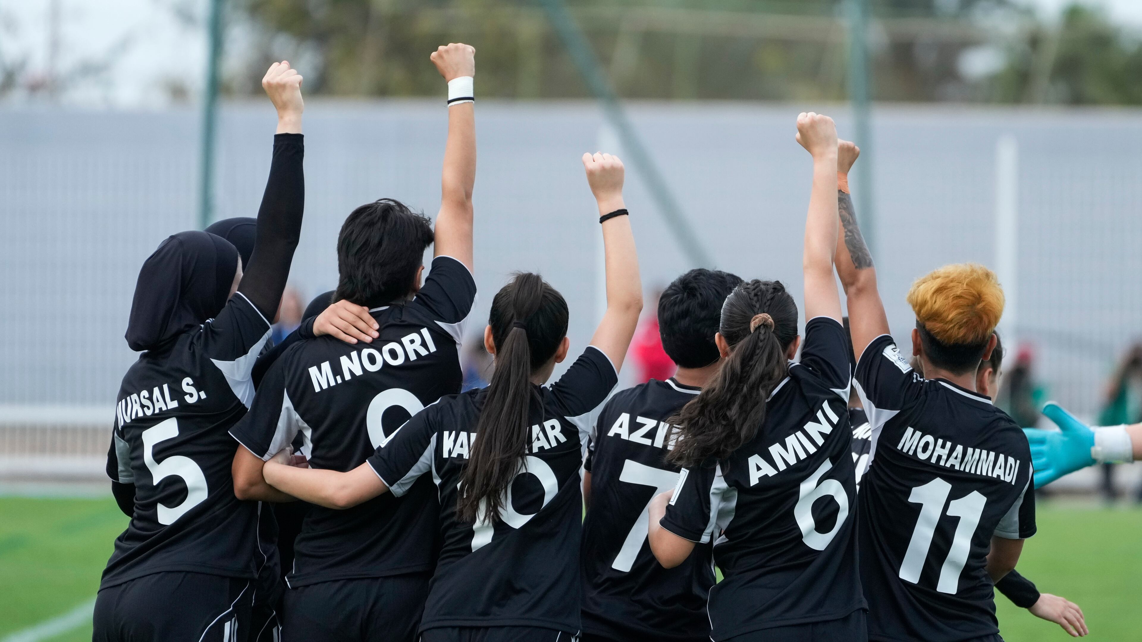 Members of Afghan Women United soccer team celebrate after scoring a goal against Chad, in their first international tournament since fleeing their country, in Casablanca, Morocco, Sunday, Oct. 26, 2025. (AP Photo/Mosa'ab Elshamy)