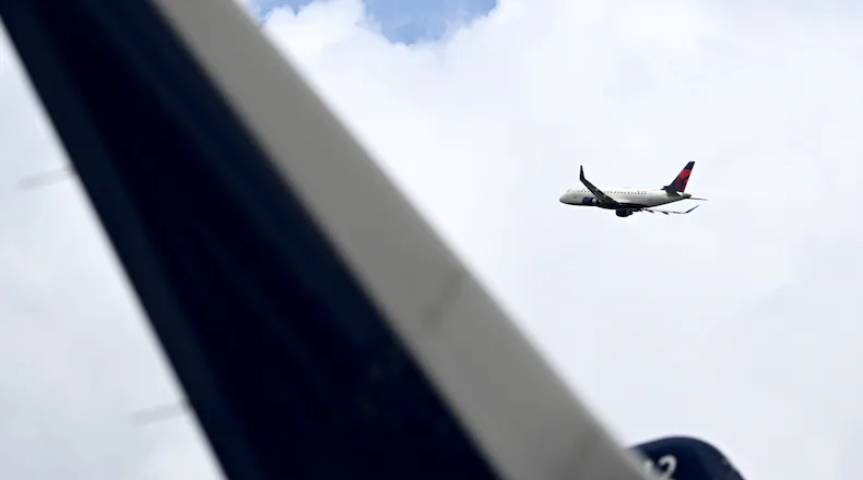 A Delta flight had to turn around and return to Atlanta on Saturday after fumes were reported in the flight deck, officials say. (Hyosub Shin/AJC)