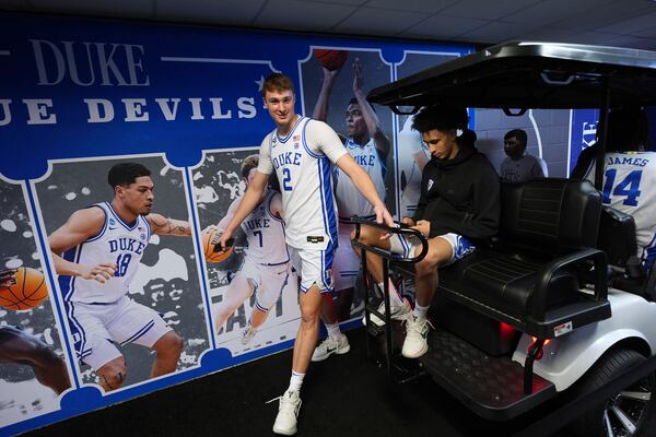 Duke's Cooper Flagg (2) walks to get on a cart during media day at the Final Four of the NCAA college basketball tournament, Thursday, April 3, 2025, in San Antonio. (AP Photo/Eric Gay)
